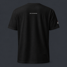 Load image into Gallery viewer, Black t-shirt with 'THE STANDARD' branding on the back and '4 AM NATION' logo on the right sleeve against a dark background